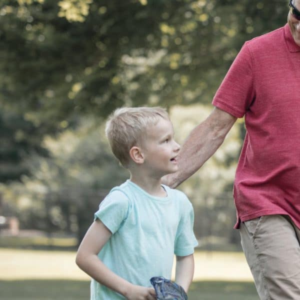 Grandpa and grandson playing baseball