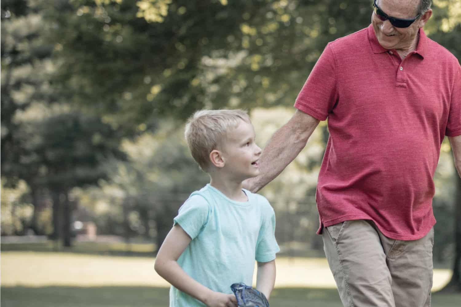 Grandpa and grandson playing baseball