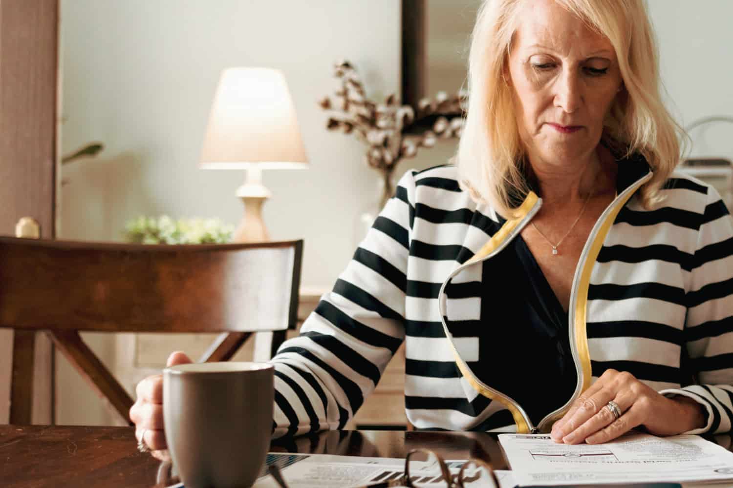 Retired woman looking over estate paperwork