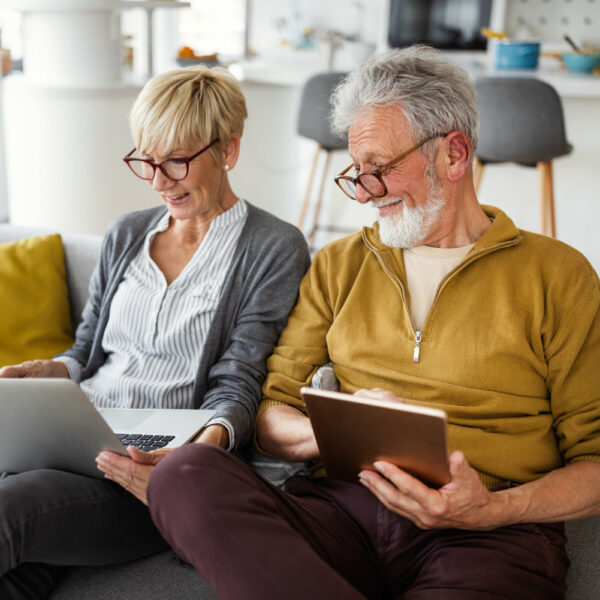 Retired couple reading on the couch