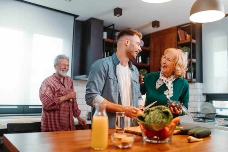 Retired couple cooking with their kids