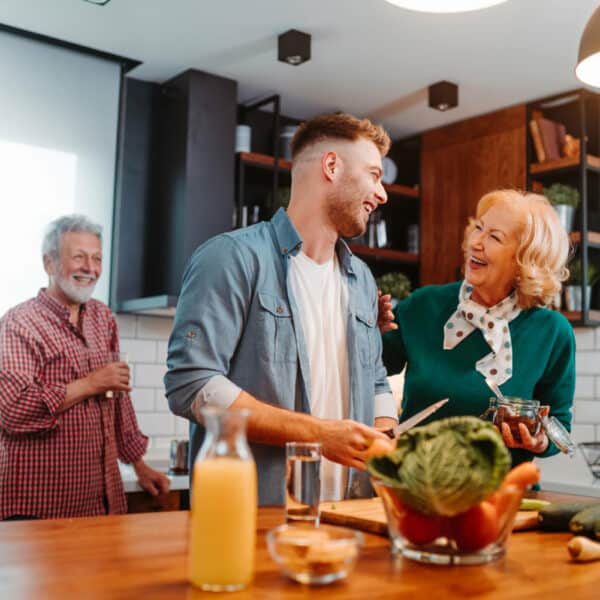 Retired couple cooking with their kids